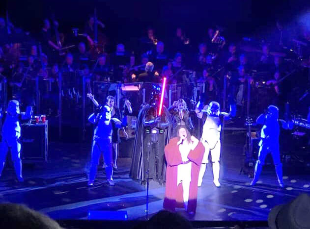 Members on stage with Weird Al.